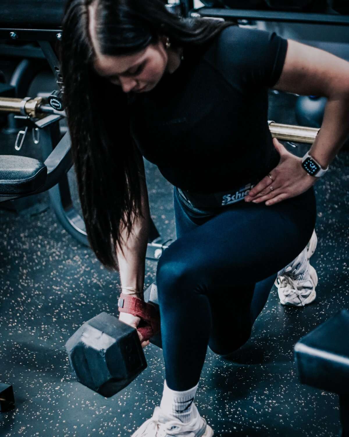 A member working through dumbbell circuits