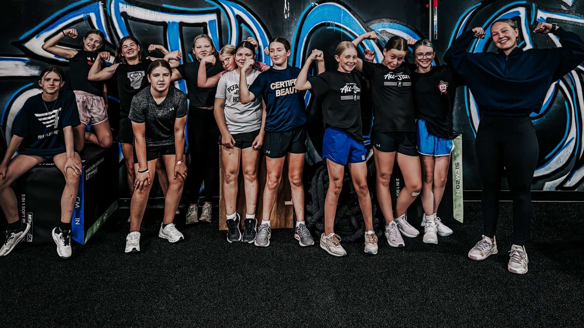 The youth class in front of the graffiti wall